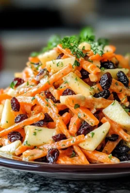 Deliciously Crunchy Carrot Apple Salad Recipe with Craisins and Creamy Dressing